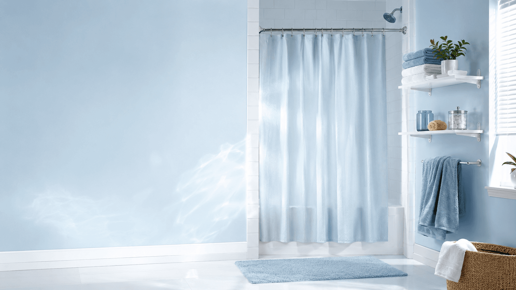 Bright bathroom refreshed with no-drill shelves, clean towels and a pale shower curtain